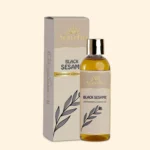 A bottle of Cold Pressed Black Sesame Oil by Ayurvedam 100ml