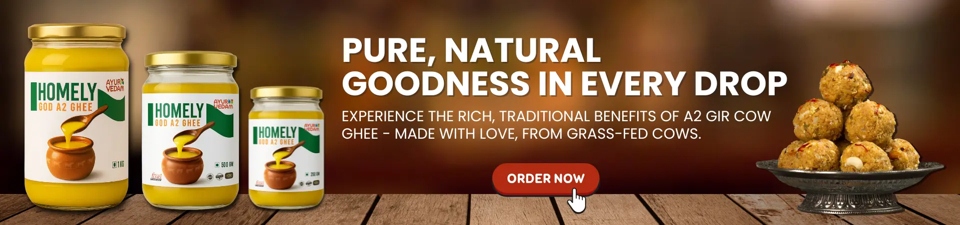 3 Jars of Ayurvedam God A2 Homely Ghee of 250g, 500g, 1kg, with sweets in the background