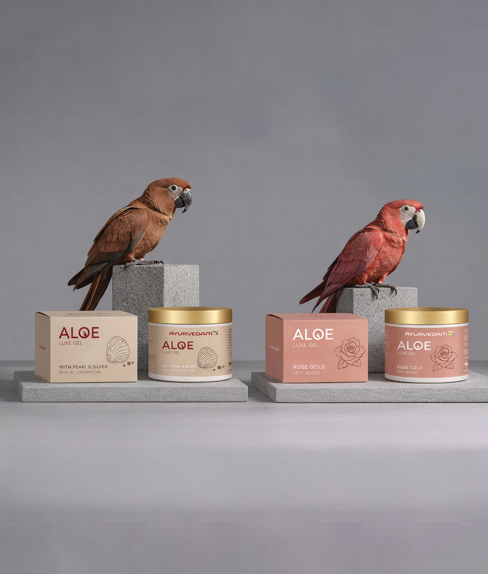 Premium packaging of Ayurvedam Aloe Luxe Gel Pearl & Silver and Rose Gold editions on stone pedestals