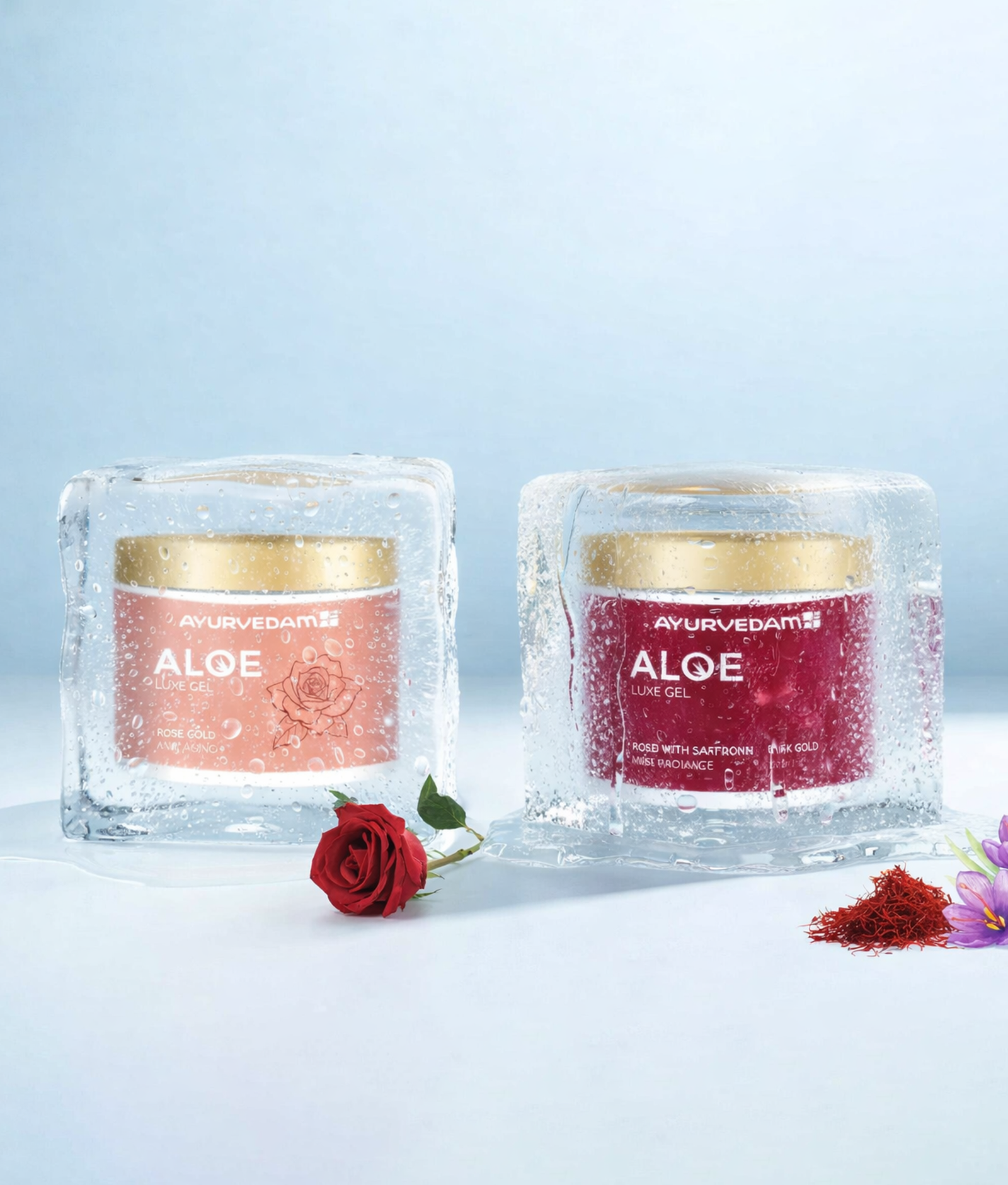 Two jars of Ayurvedam Aloe Luxe Gel, Rose Gold and Saffron variants, encased in melting ice blocks with a fresh red rose and saffron strands in the foreground.