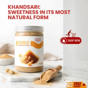 Ayurvedam Homely Khandsari Sugar natural sweetener in a 500g jar with a wooden scoop on a marble surface.