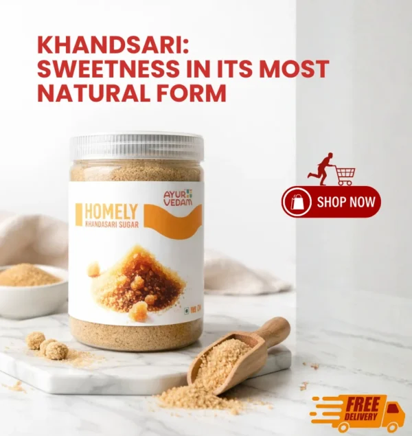Ayurvedam Homely Khandsari Sugar natural sweetener in a 500g jar with a wooden scoop on a marble surface.